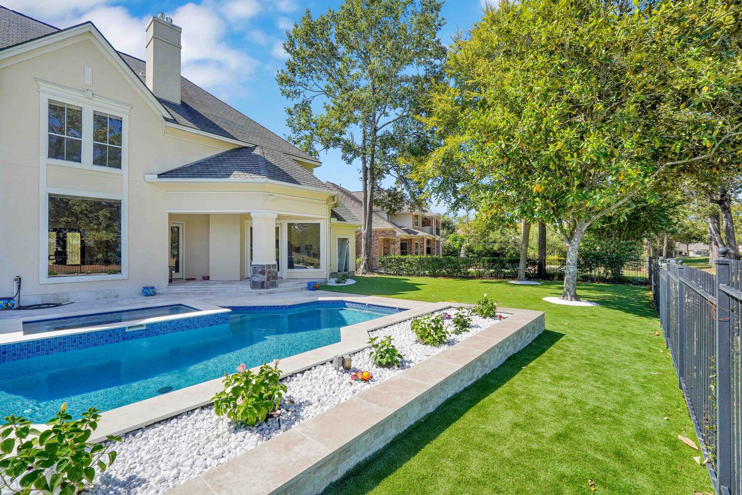 Artificial grass in the backyard by the poolside - Orion Turf and Landscape