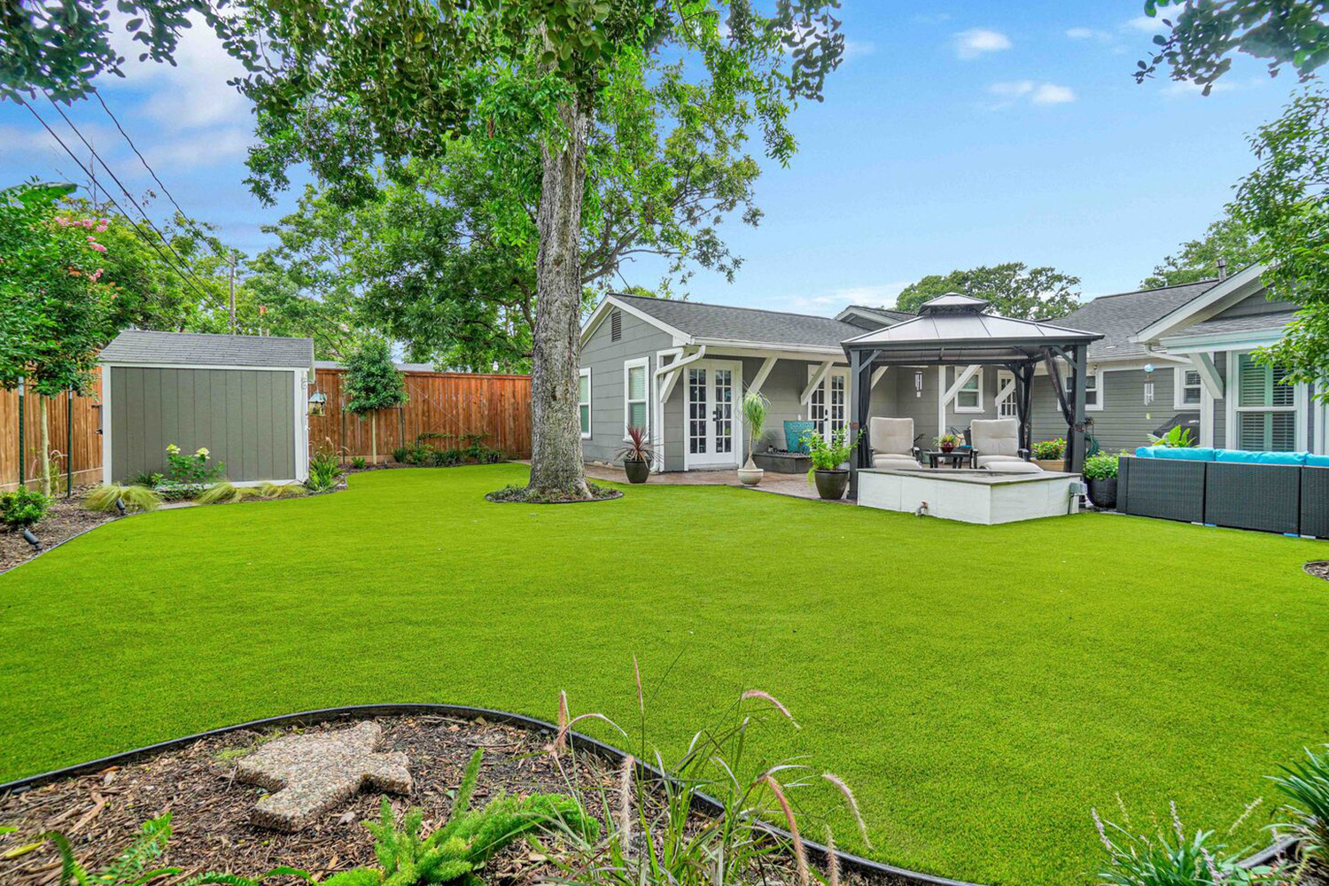 Artificial grass in the backyard by the poolside - Orion Turf and Landscape